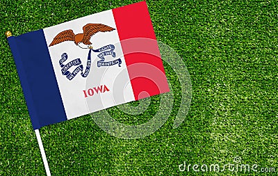 Close-up of Iowa flag against closed up view of grass Stock Photo