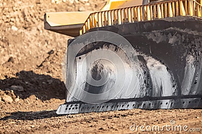 Close up of an iron excavator bulldozer bucket with parts soil for loading Stock Photo