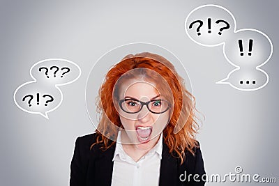 Close up isolated portrait of young annoyed angry woman. Negative human emotions face expressions. Isolated portrait on a gray bac Stock Photo