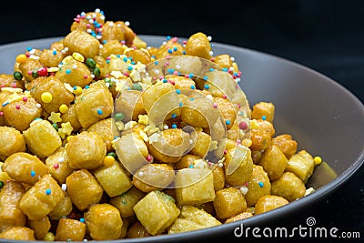 Close Up Of Italian Traditional Food Called Strufoli On Black Ba Stock Photo