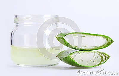 Close up jar of aloe vera gel with sliced aloe vera leaf isolated on white background with clipping path. Stock Photo