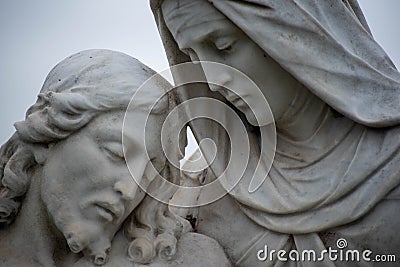 Close up of Jesus and Mary in cemetery pieta statue. Stock Photo