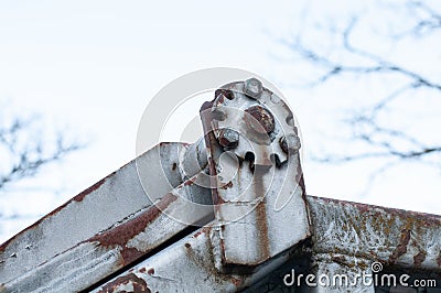 Hinge at old rusty container with welding seams Stock Photo