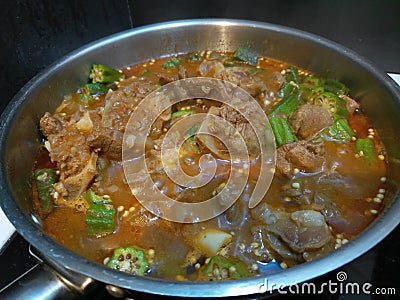 Close up of juicy stew cooking in a large pot Stock Photo