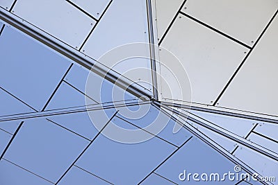 Close-up of junction of arrises of building with white tiled walls Stock Photo