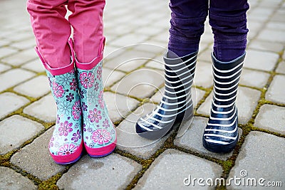 Close up of kids legs in wellington boots Stock Photo