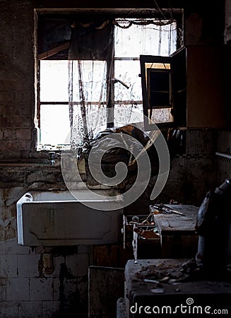 Close up of kitchen left in appalling condition in derelict 1930s deco house. Rayners Lane, Harrow UK Stock Photo