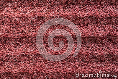 A close up of knitted woolen texture of coral color. Hand made Stock Photo