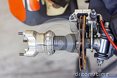 Close up knuckle front wheel hubs and caliper disc brake unit assembly on shaft of go kart mini racing car Stock Photo