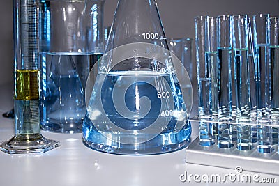 Close up of labware such as beaker, flask, graduated cylinders and test tubes well placed Stock Photo