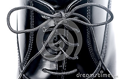 Close up of laces on a black leather shoe Stock Photo