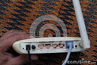 Close up lan network connected to Ethernet RJ45 port to wireless modem router network hub Stock Photo