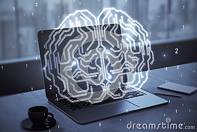 Close up of laptop computer on desktop with coffee cup and glowing human brain hologram on screen and blurry background. Neurology Editorial Stock Photo