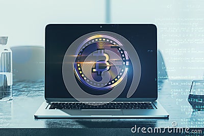 Close up of laptop on desk with creative glowing digital bitcoin on blurry workplace background with binary coding. Virtual Stock Photo