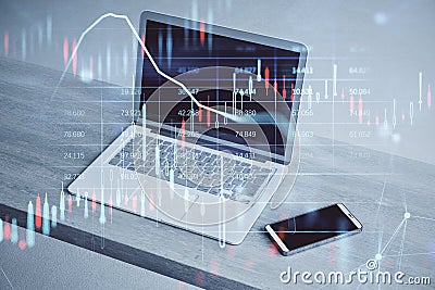 Close up of laptop and smartphone on wooden desktop with glowing candlestick forex chart and map hologram on blurry background. Editorial Stock Photo