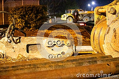 Close-up of large Construction Equipment in an Evening Background. Stock Photo