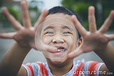 Close up laughing face of asian children playing with happiness emotion Stock Photo