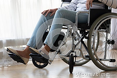 Close up disabled older woman sitting in wheelchair alone Stock Photo