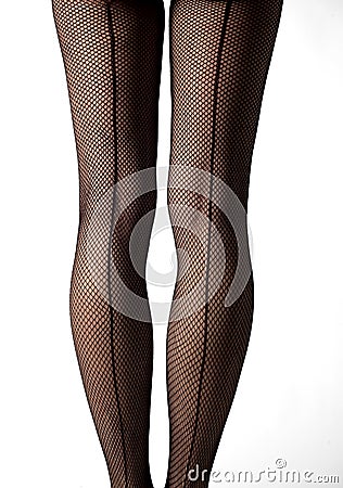 Close-up of legs with fishnet stockings and back line Stock Photo