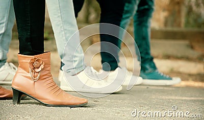 Close up of legs, Group of friends hanging out together - friendship, travel, tourism, summer vacation and people Stock Photo