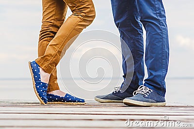 Close-up of legs of the kissing couple Stock Photo