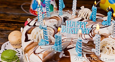 Close up of lettering `happy birthday` on homemade birthday cake Stock Photo