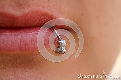 Close-up of lips and piercings Stock Photo