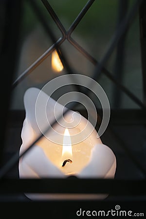 Close up of a Lit Candlelight Lamp in the cemetery. Stock Photo