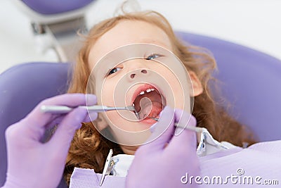 Close-up little girl at dentist Stock Photo