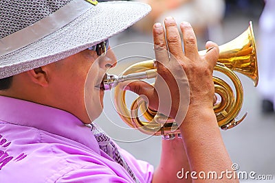 Close up of a local man playing trumpet during Festival of the V Editorial Stock Photo
