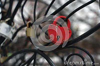 Close up of lock on iron construction. Locks of love its romantic tradition of newlyweds. Stock Photo