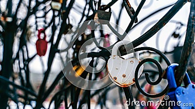 Close up of lock on iron construction. Locks of love its romantic tradition of newlyweds. Stock Photo
