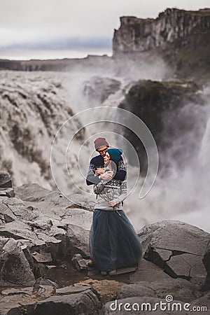 Close up lovely portrait of young hipster couple kissing together near Dettifoss Stock Photo