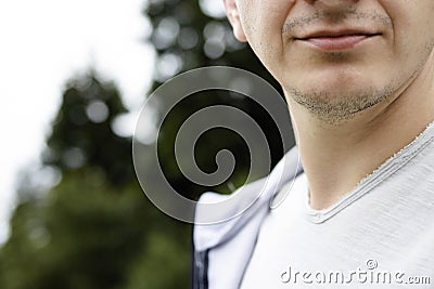 Close-up of the lower part of the young man& x27;s face. Chin, bristles Stock Photo