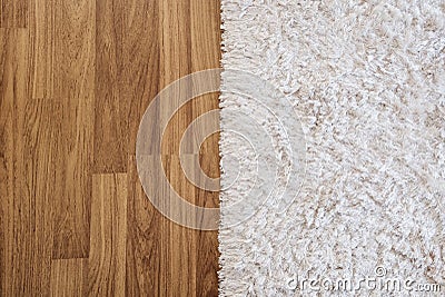 Close-up luxury white carpet on laminate wood floor in living room, interior decoration Stock Photo