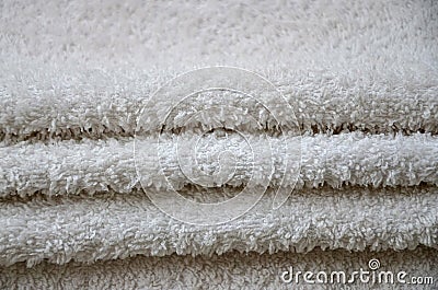 Close-up macro photo of a stack of many small white towels Stock Photo