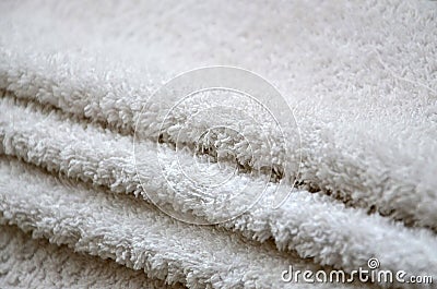 Close-up macro photo of a stack of many small white towels Stock Photo