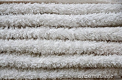 Close-up macro photo of a stack of many small white towels Stock Photo