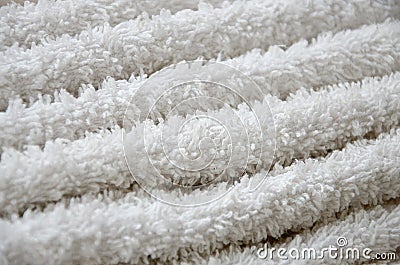 Close-up macro photo of a stack of many small white towels Stock Photo