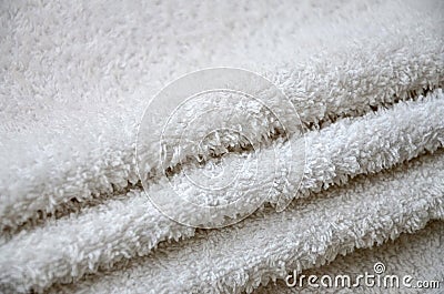 Close-up macro photo of a stack of many small white towels Stock Photo