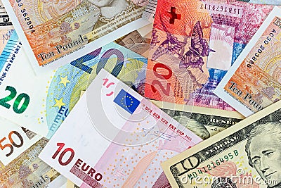 Close-up macro photography of dollar, pound, euro and frank. Business money exchange concept background. Editorial Stock Photo