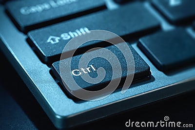 Close-up macro shot of the black keys of a desktop computer keyboard. Selective focus on the Ctrl key. Toned Stock Photo
