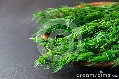 Close up macro shot of fresh green dill herbs on a plate Stock Photo