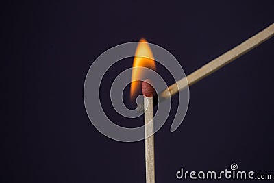 Close up Macro shot of a ignition match on a second match captured in super slow motion Stock Photo