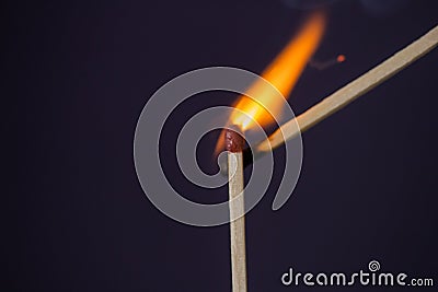 Close up Macro shot of a ignition match on a second match captured in super slow motion Stock Photo