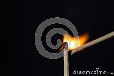 Close up Macro shot of a ignition match on a second match captured in super slow motion Stock Photo