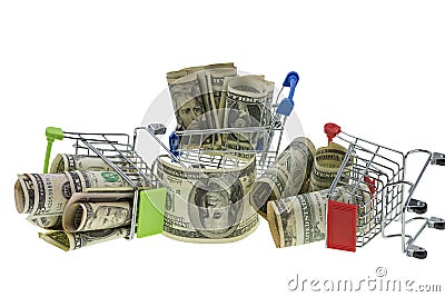 Close up macro view of three shopping carts filled with rolled dollar bills Stock Photo