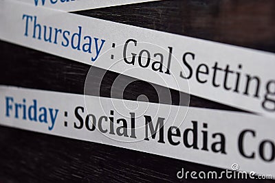 Close up making agenda weekly schedule on personal organizer. Business and entrepreneur concept. Isolated on blackboard Stock Photo