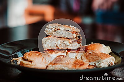 Close up of Malaysian well known food `Roti John` on a dark background. Stock Photo