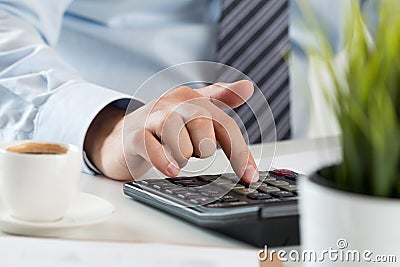 Close up of male accountant making calculations Stock Photo